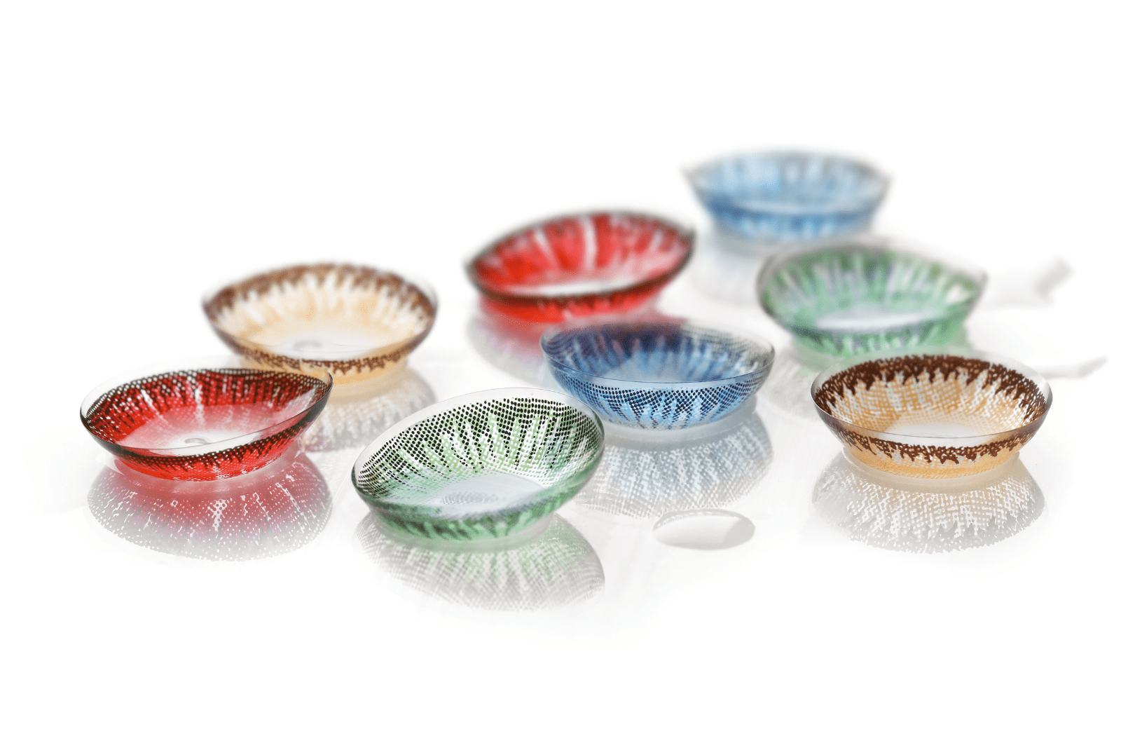 A variety of colored contact lenses sitting out, colors include blue, red, green, and orange