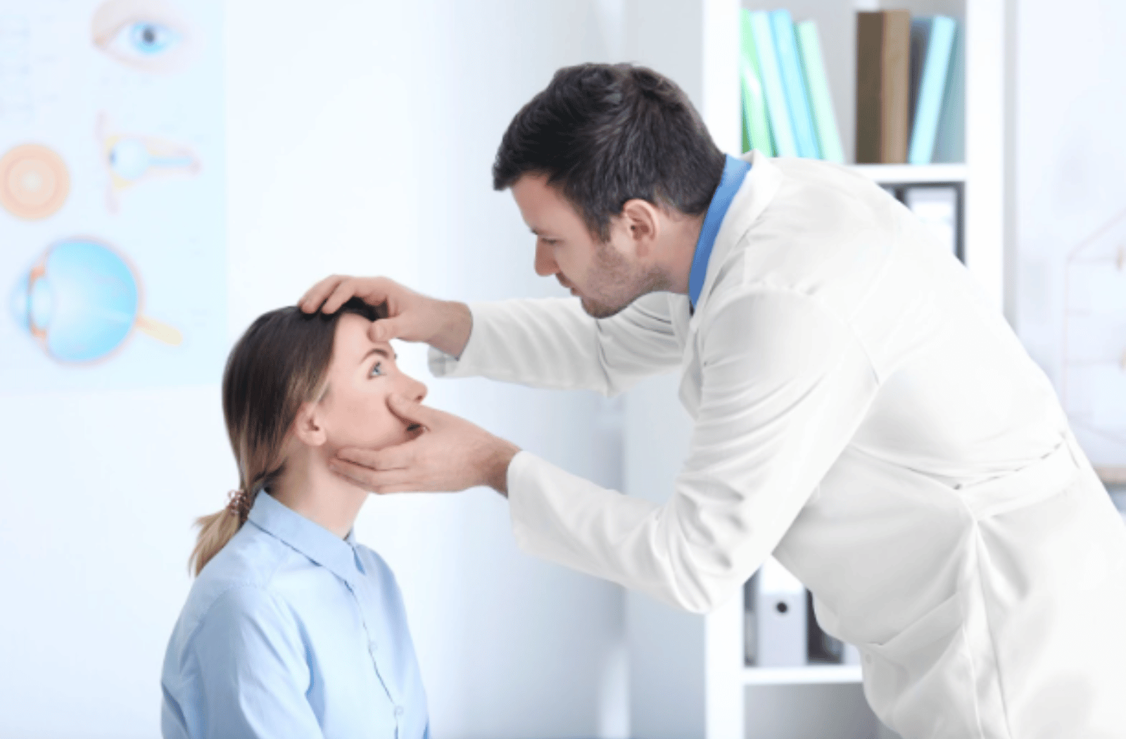 An eye doctor examines a female patient's eyes.